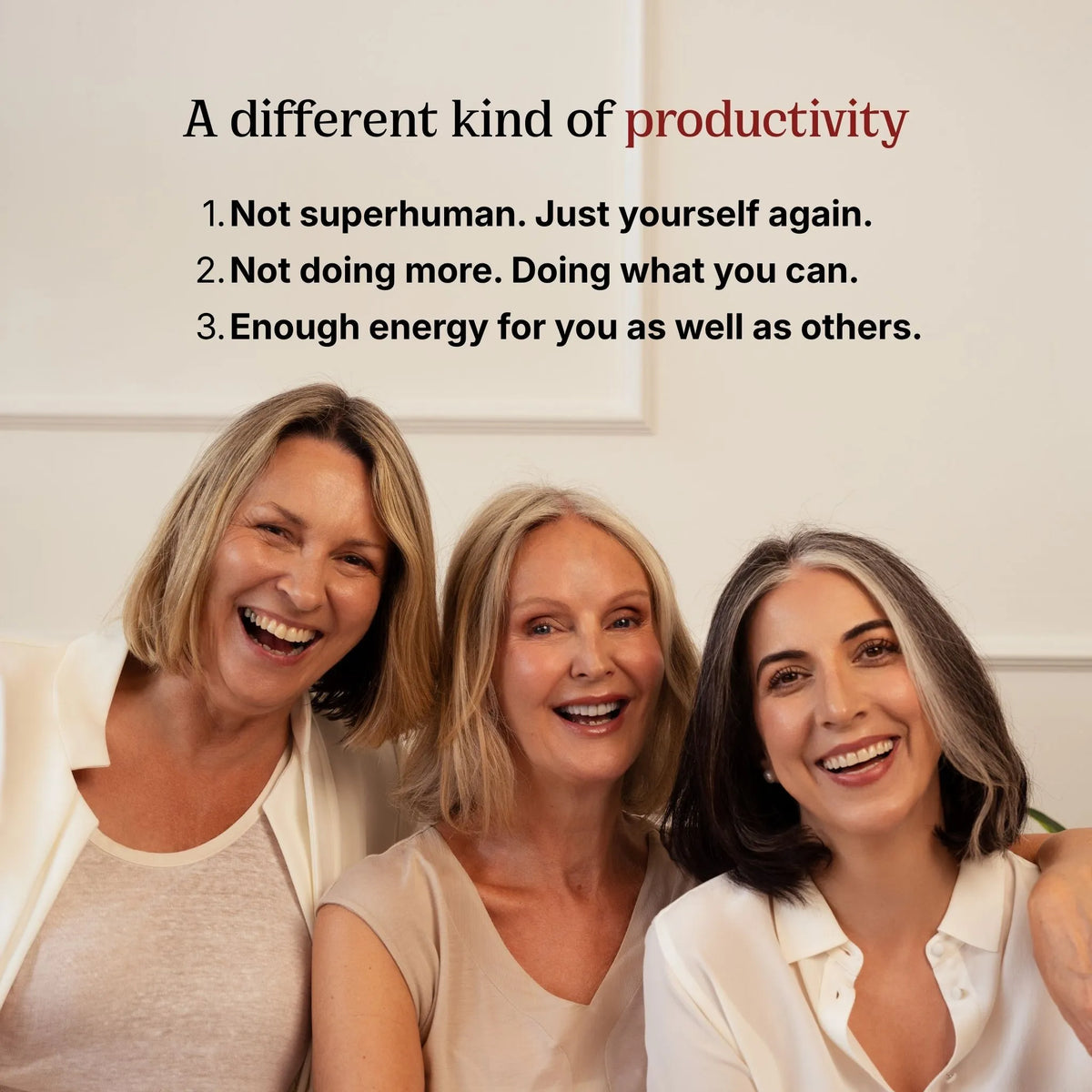 Three smiling women standing together against a light wall, with overlaid text that reads: 'A different kind of productivity' followed by three bullet points about not being superhuman and not doing more.